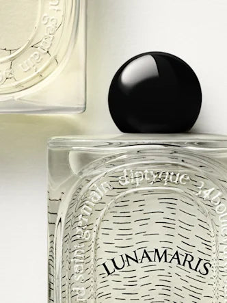 A black spherical cap in a nod to traditional fine perfumery.